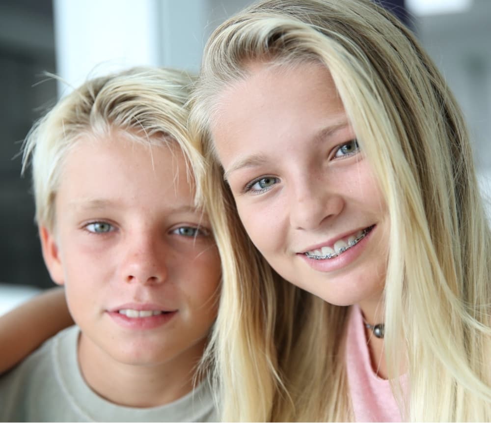 young patient smiling wearing braces