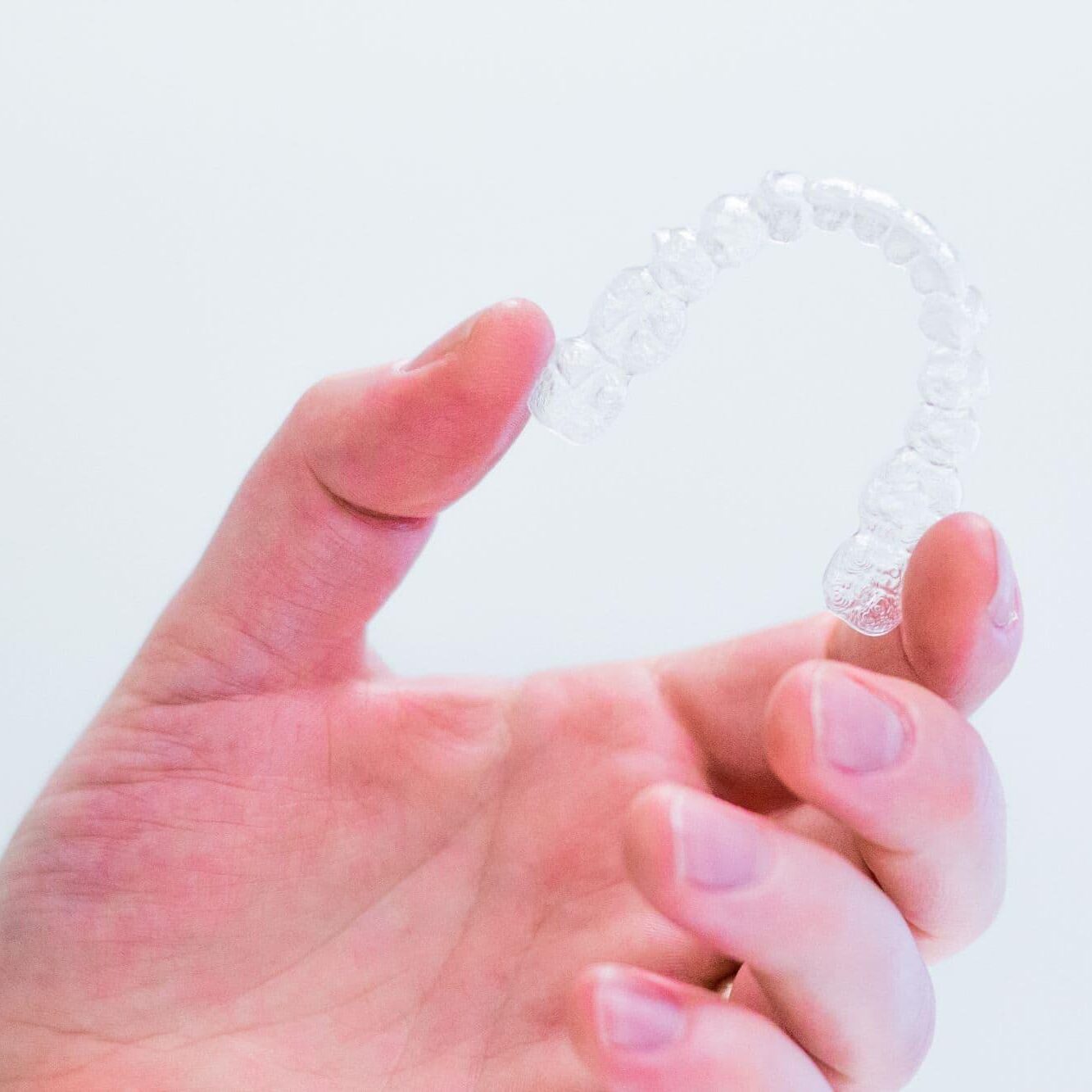 hand-holding-unbranded-aligners